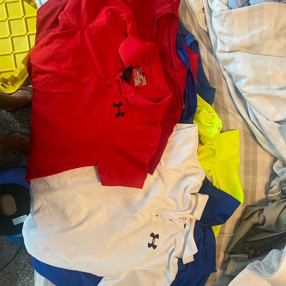Random Assortment of kids under Armour and Nike shirts and polos